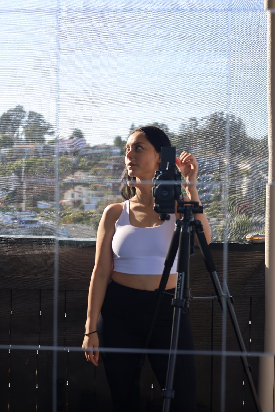 Angie working with her camera on a tripod