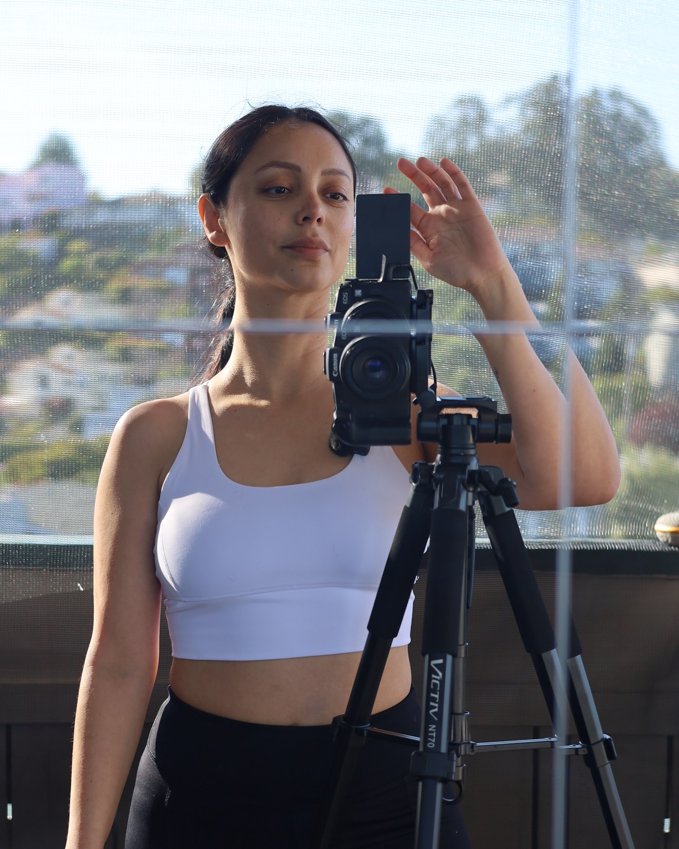 Angie at her camera, ready to shoot in the Bay Area