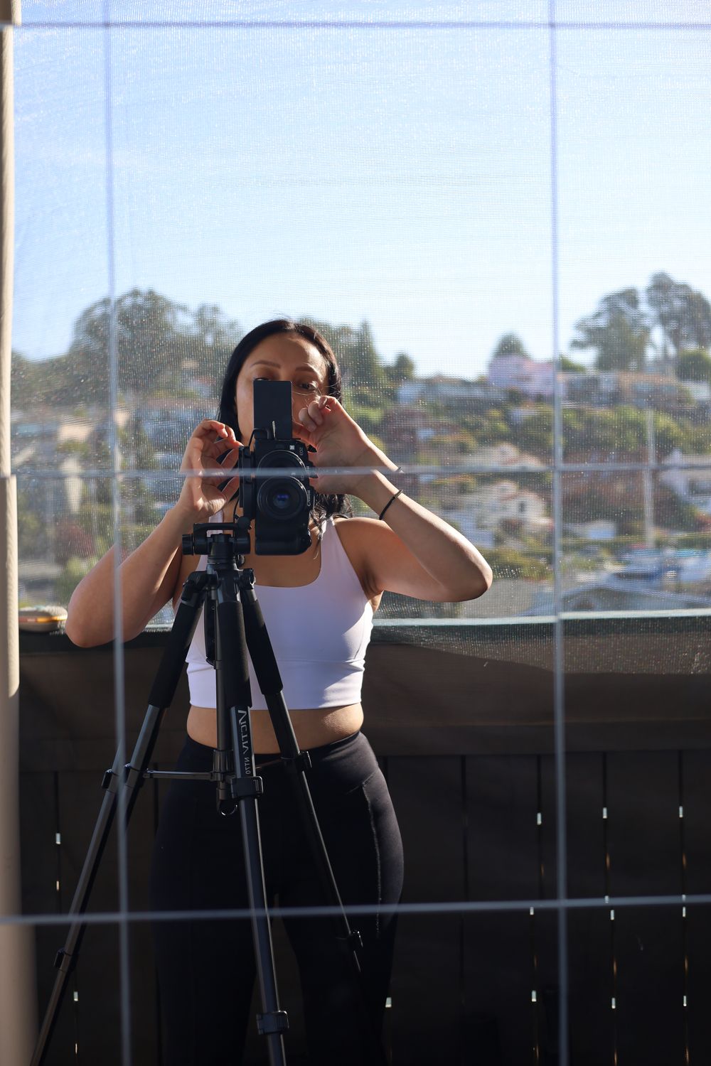 Angie shooting behind the camera